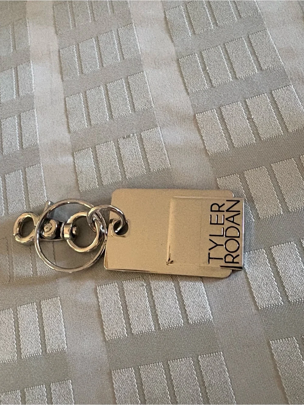 Tyler Rodan Silver Branded Metal Key chain